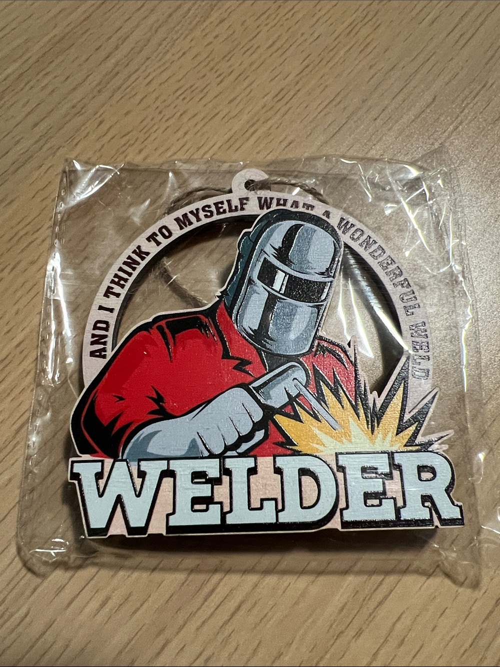 Welder Graphic Ornament - Red Jacket with Yellow Sparks